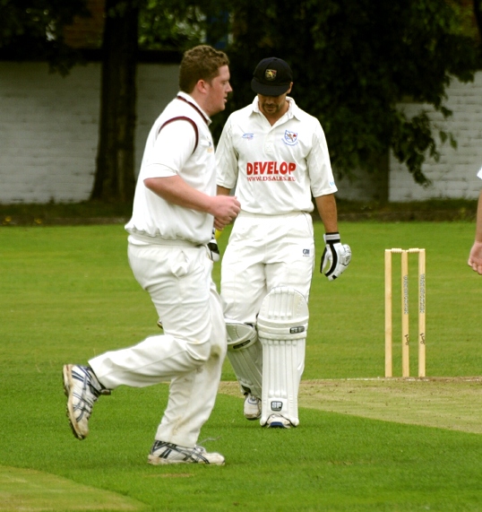 WERNETH’S Matthew Taylor celebrates after team-mate Joe Taylor claims the wicket of Littleborough’s Warron Williams, who trudges off. WERNETH’S Matthew Taylor celebrates after team-mate Joe Taylor claims the wicket of Littleborough’s Warron Williams, who trudges off.