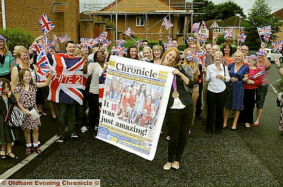 MAKING THE NEWS... Nicola White with a giant front page of the Oldham Chronicle reporting her Olympic success.
MAKING THE NEWS... Nicola White with a giant front page of the Oldham Chronicle reporting her Olympic success.