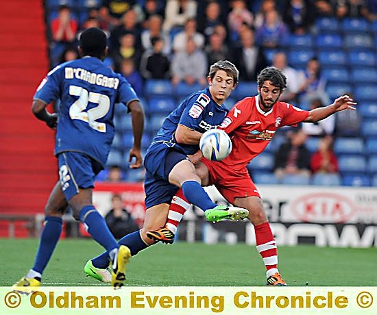 THAT’S MINE . . . defender James Tarkowski is first to the ball.