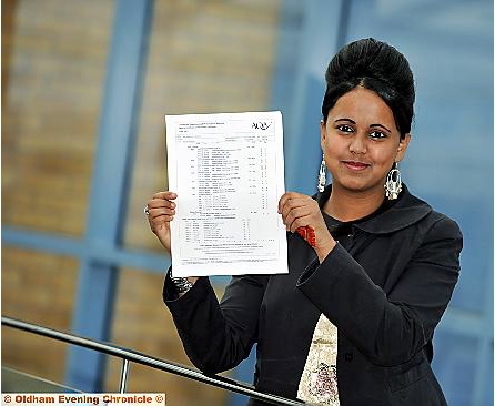 Jesmin with her GCSE results  

