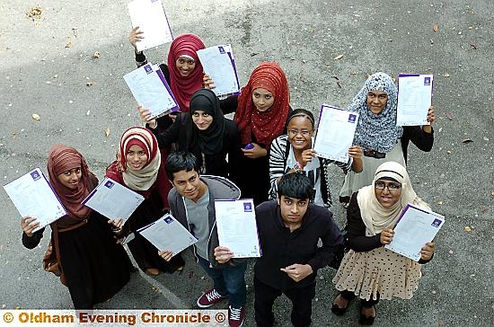 ELATED: Oldham Academy North pupils, Feiruz Abdullahi, Amina Begum, Aysha Begum, Karima Begum, Khadiza Begum, Abdul Amin Gani, Abul Hussein, Farjana Khatun, Moryam Begum and Farzana Yasmin, celebrate a round of top results. 
