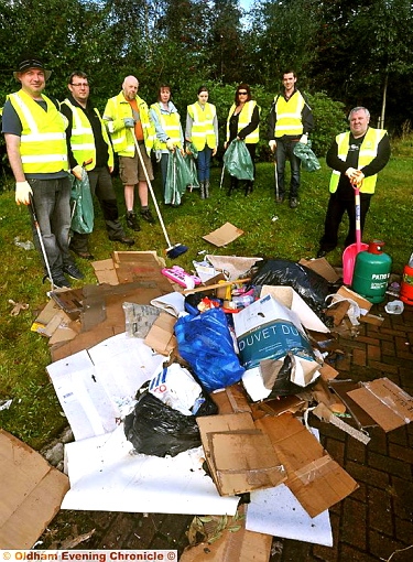 CLEANING up the mess: volunteers with Councillor Steven Bashforth, right 
