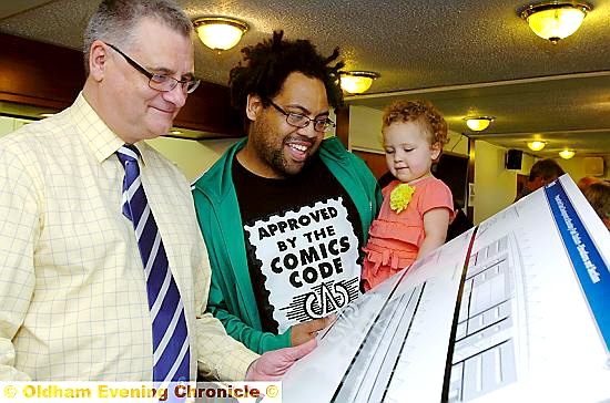 THUMBS-UP: Latics director Ian Hill showing Che Burnley and daughter Maya (2) the plans  

