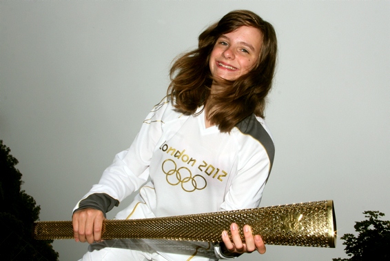 LIGHTING the way: Catherine Stott (12), a London 2012 torchbearer, helped to open the Saddleworth Games. 
