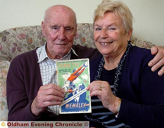 FINDERS keepers: former United ’keeper Jack Crompton and his wife Sheila show off the 1948 cup final programme and (below) the United team from that day 
