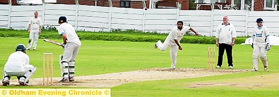 LOSING BATTLE . . . Royton pro Mohammed Zaman Khan tries in vain to break through against Rochdale. 