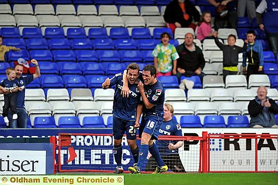 PLENTY TO SMILE ABOUT: Jose Baxter (left) celebrates his debut goal with Cliff Byrne. 
