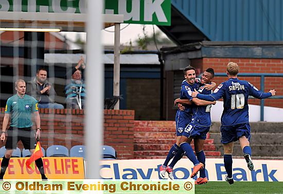 Matt Derbyshire (left) celebrates his goal with his new teammates 