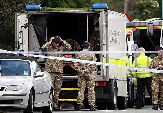 BOMB disposal team; soldiers stand next to a Royal Logistic Corps van at the scene yesterday 