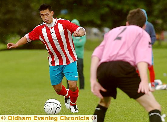 ON THE ATTACK . . . Crompton House player Jeffrey Ho, formerly of Manchester City and Stoke, takes the game to Willow Tavern. ON THE ATTACK . . . Crompton House player Jeffrey Ho, formerly of Manchester City and Stoke, takes the game to Willow Tavern.