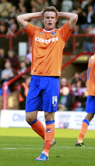 SO CLOSE: Matt Smith reacts after being denied by Brentford goalkeeper Simon Moore. SO CLOSE: Matt Smith reacts after being denied by Brentford goalkeeper Simon Moore.