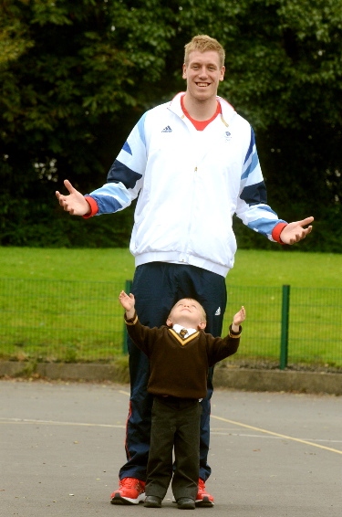 LITTLE and large: towering Joe O’Regan with four-year-old Ben Greenwood LITTLE and large: towering Joe O’Regan with four-year-old Ben Greenwood
