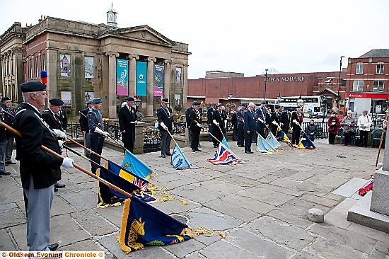 RESPECT . . . as flags are lowered at the war memorial 