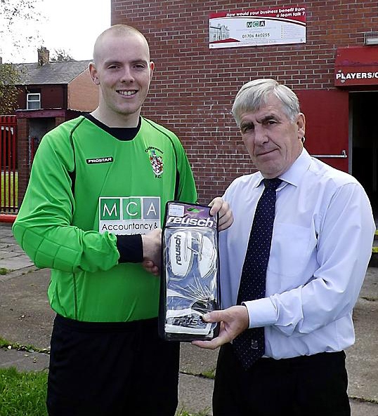 PRIZE GUY. . . Chadderton’s Dale Latham receives his goalkeeper of the month award from Geoff Wilkinson of the North-West Counties League. PRIZE GUY. . . Chadderton’s Dale Latham receives his goalkeeper of the month award from Geoff Wilkinson of the North-West Counties League.