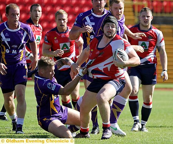 MICHAEL Ward tries to get away from a tackle for Oldham. 