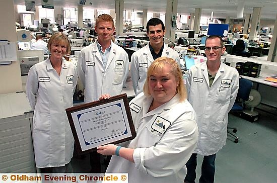 WE’VE done it: Lyn Cooper displays the Nadcap accreditation certificate with colleagues (left-right) Ann Sharphouse, Ash Lomas, Paul Cox and Andrew Woodhead 
