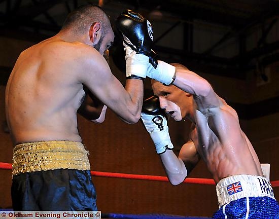 GO FOR IT . . . Ashley Mayall in action against Sid Razak. GO FOR IT . . . Ashley Mayall in action against Sid Razak.