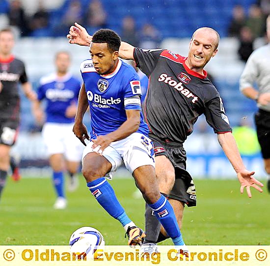 ACTION MAN . . . the tireless Korey Smith presses Athletic forward.