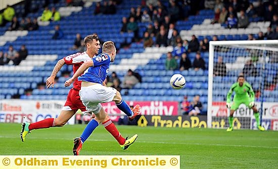 HOT SHOT . . . Carl Winchester lets fly to score a sensational goal. 