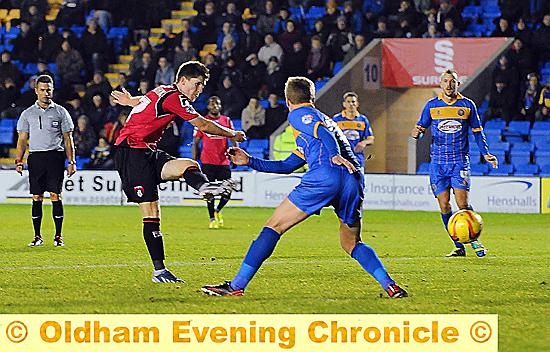 POINTS IN THE BAG . . . Danny Philliskirk fires home Athletic’s winner at Greenhous Meadow last night. POINTS IN THE BAG . . . Danny Philliskirk fires home Athletic’s winner at Greenhous Meadow last night.