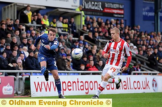 GOING FOR GLORY: Jose Baxter blasts a cross into the penalty area. 