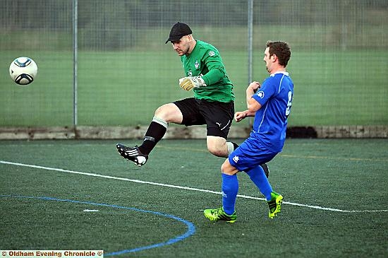 Crompton Keeper Matthew Wheelton clears from Failsworth’s Danny Allott