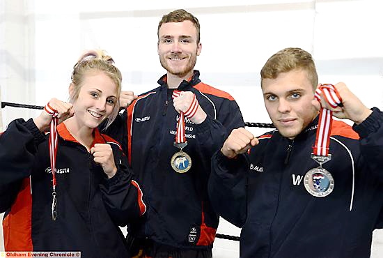 TOUGH GUYS . . . Siam Camp Thai boxers (left to right) Bethany Gee, Bradley Tunnacliffe and William White show off their medals. TOUGH GUYS . . . Siam Camp Thai boxers (left to right) Bethany Gee, Bradley Tunnacliffe and William White show off their medals.
