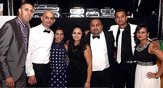 Glammed up for charity (l-r): Prital Sachdev, who catered for the evening, organisers Suresh Patel and wife Nila Patel, friends Sonal Patel and husband Sasi Patel, Nila’s nephew Anil Hirani, whose wife died from cancer, and his sister Chetna Hirani. (Picture by Jiresh Photography) 
