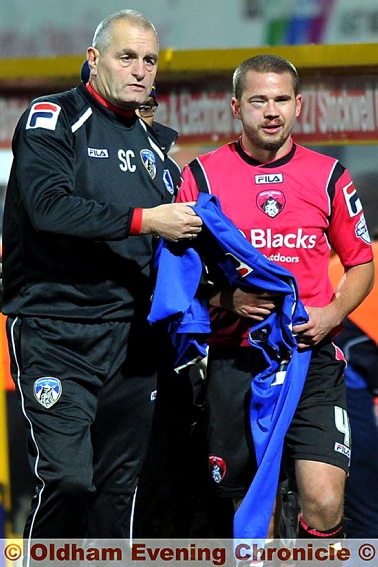 Latics OUCH . . . James Wesolowski comes off with a nasty eye injury. 