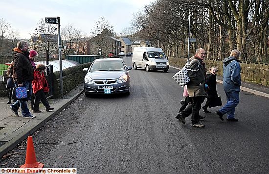 DANGER crossing: parents and pupils outside St Mary’s Primary School which has no road markings DANGER crossing: parents and pupils outside St Mary’s Primary School which has no road markings