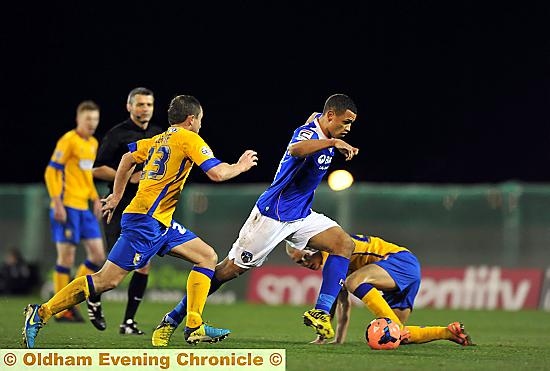 DIRECT ROUTE . . . Jonson Clarke-Harris runs straight at the Mansfield defence.