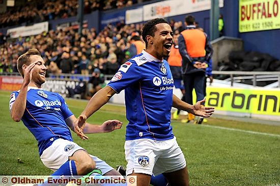 ACTION MAN . . . the outstanding Korey Smith celebrates his goal with Adam Rooney. 