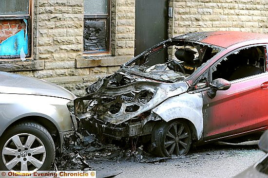 DESTROYED . . . two cars on Hawthorn Crescent Up in flames 