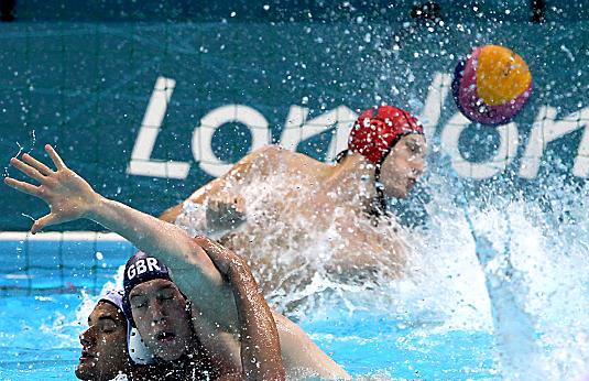 worrying times: Royton’s Joe O’Regan (blue cap), in action against Romania in the London Olympics, says there is “a lot of uncertainty’ in men’s water polo. worrying times: Royton’s Joe O’Regan (blue cap), in action against Romania in the London Olympics, says there is “a lot of uncertainty’ in men’s water polo.