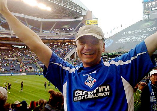 COME on you blues . . . Martin Smith wearing his Latics shirt to a Seattle Sounders game  


