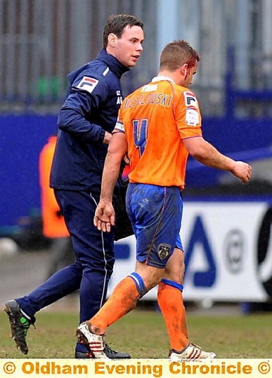 ATHLETIC midfielder James Wesolowski walks off the field with blood pouring from a head wound.
ATHLETIC midfielder James Wesolowski walks off the field with blood pouring from a head wound.