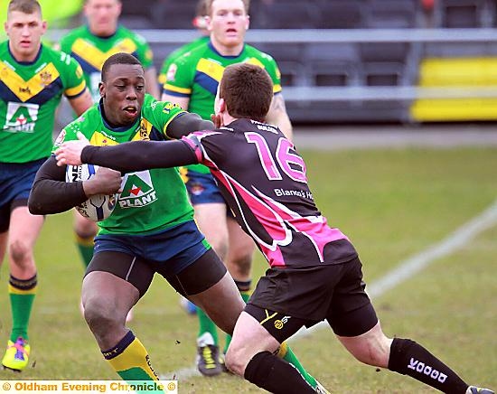 Oldham’s Mo Agoro takes on Scorpions Connor Farrer 
