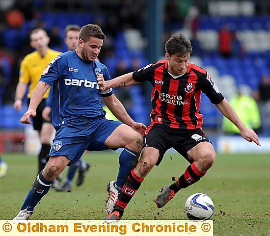JAMES WESOLOWSKI (left) battles for possession. JAMES WESOLOWSKI (left) battles for possession.