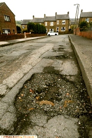 NOT unusual: potholes in Springwood, Delph 
