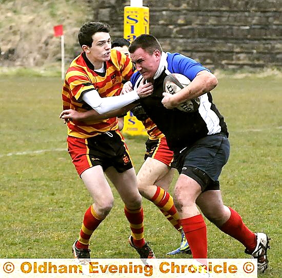 Oldham’s Stuart Brennan looks to make progress.