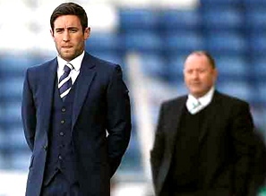 I’M BEHIND YOU: Lee Johnson and dad Gary keep a close eye on proceedings. 