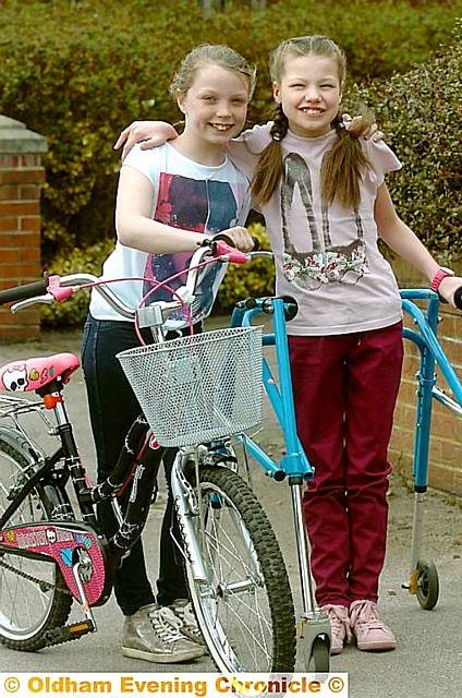 SISTERS in arms . . . Katie (10), left, and Ellen (12)
SISTERS in arms . . . Katie (10), left, and Ellen (12)