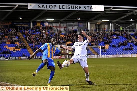 ATHLETIC defender Cliff Byrne tries to get in a block. 