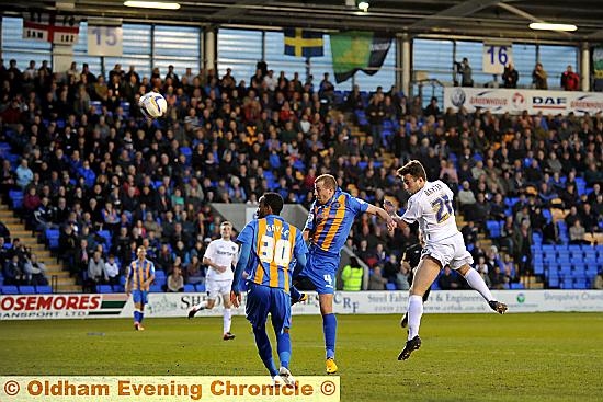 UP AND AT ’EM. . . forward Jose Baxter looks to steer a header towards the Shrewsbury goal on a poor night for Athletic. 