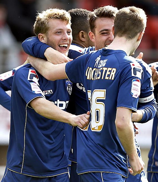 FEELGOOD FACTOR:Kirk Millar and team mates celebrate his equalising goal. 
