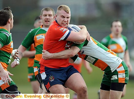 DANNY Langtree takes the ball up for Oldham.