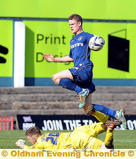 Matt Smith is denied a chance by ’keeper Mark Gillespie. 