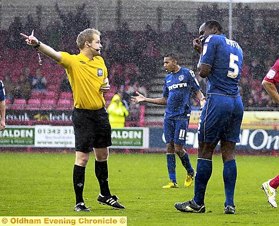 off you go: Athletic defender Jean-Yves Mvoto gets his marching orders at Crawley — one of five red cards for the club last season. off you go: Athletic defender Jean-Yves Mvoto gets his marching orders at Crawley — one of five red cards for the club last season.