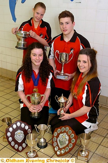 GALA GLORY . . . Oldham Swimming Club team members swept the board at the Warburton's Gala in Salford. Pictured are (back): Grace Booth (left) and Bradley Ratcliffe. Front: Olivia Askew (left) and Rebecca Owens. GALA GLORY . . . Oldham Swimming Club team members swept the board at the Warburton's Gala in Salford. Pictured are (back): Grace Booth (left) and Bradley Ratcliffe. Front: Olivia Askew (left) and Rebecca Owens.