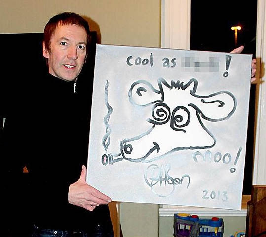 Inspiral Carpets' Clint Boon and his painting of the band's famous cow logo 

